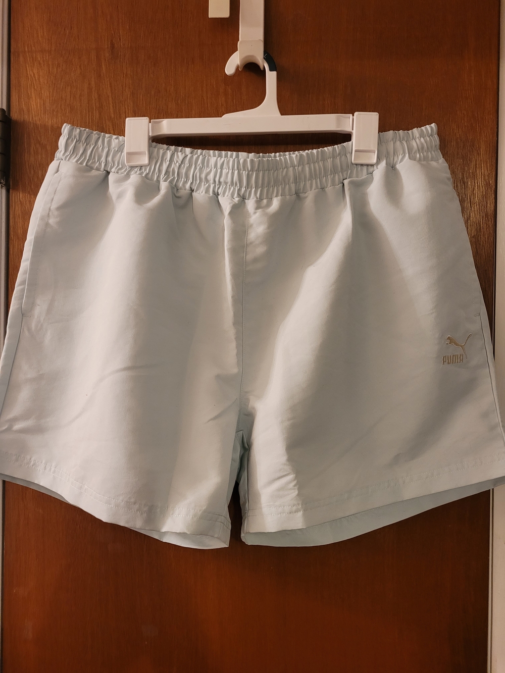 Puma Women's Pale Blue Athletic Shorts with Gold Logo